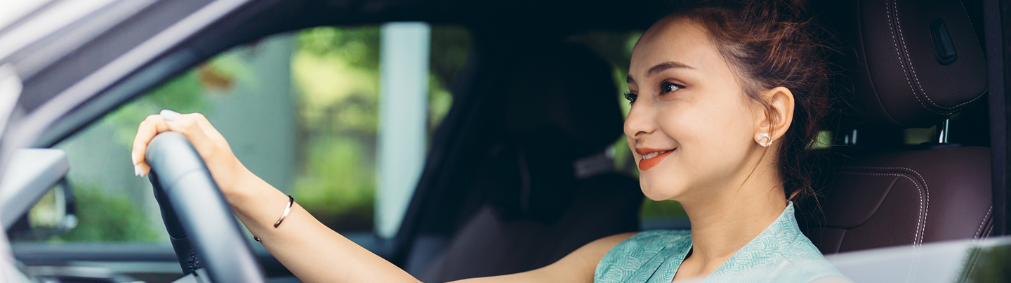 Happy woman driving